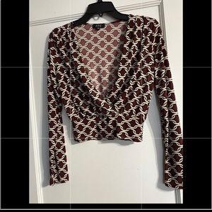 Privy long sleeved cross over top. Size small. Never worn.